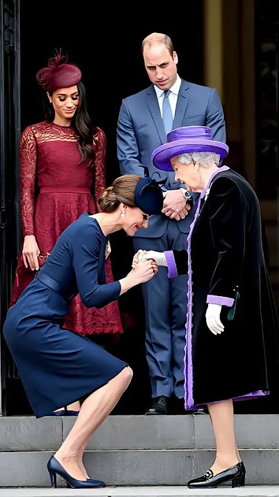 Queen Elizabeth holds him in her arms.#George #william #catherine #princess