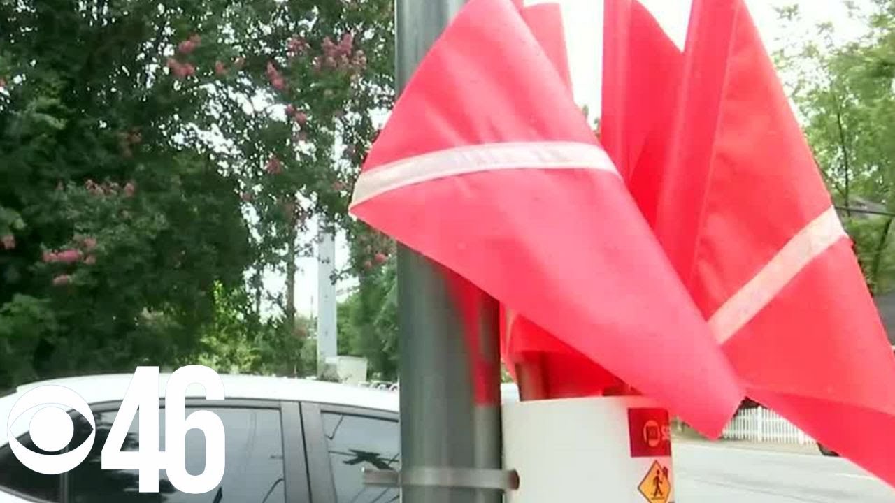 Concerned Midtown Atlanta residents add crosswalk flags at busy intersection