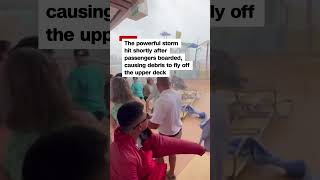 Watch cruise passengers flee flying lounge chairs, debris as storm hits