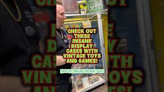This display case is filled with vintage toys and games!