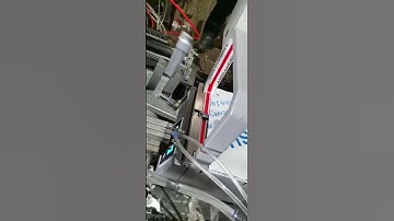 Automated Packaging of Metal Stamped Parts Using Our Bundling Machine in Conjunction with Robotics