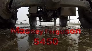 Tractor with Iron Wheels [Massey Ferguson 5450 spraying in rice fields]