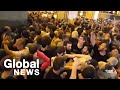 Chaotic scenes as protesters storm Georgia's parliament buildings
