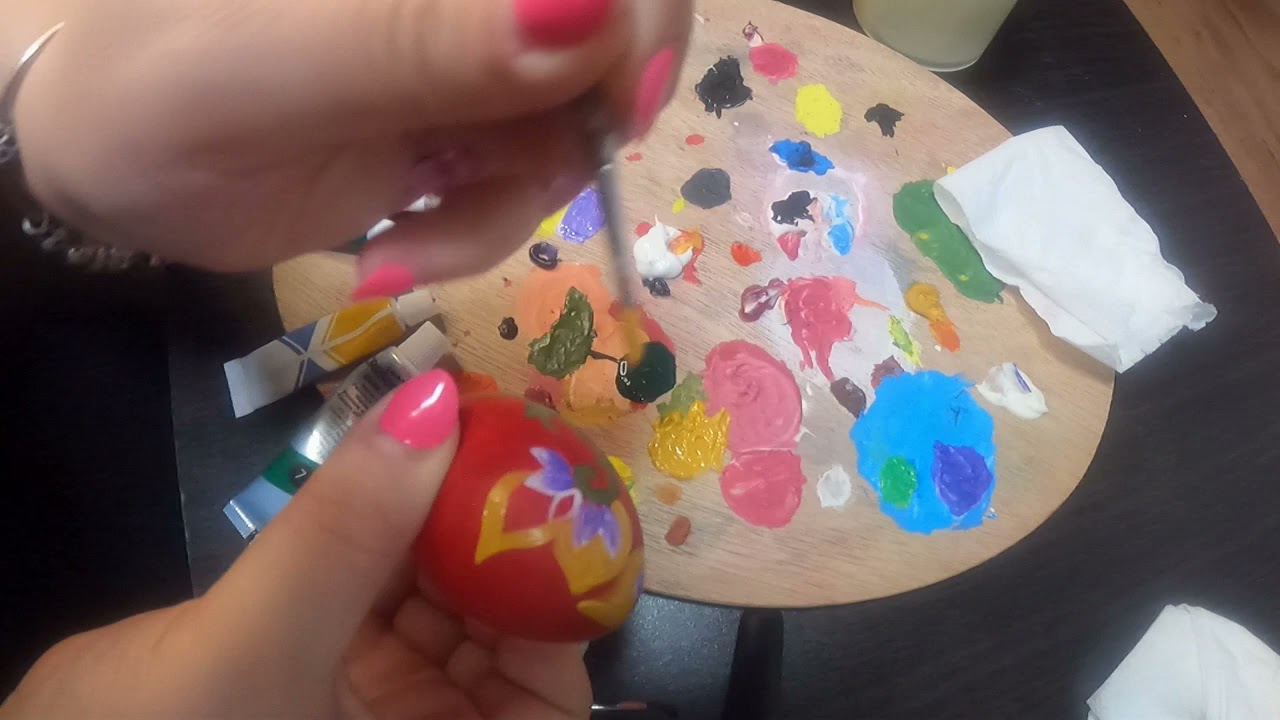 Preparation for Easter. Painting on a wooden egg.