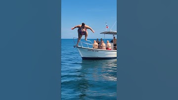A fat lady jumps from boat