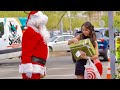 Santa gives strangers expensive gifts