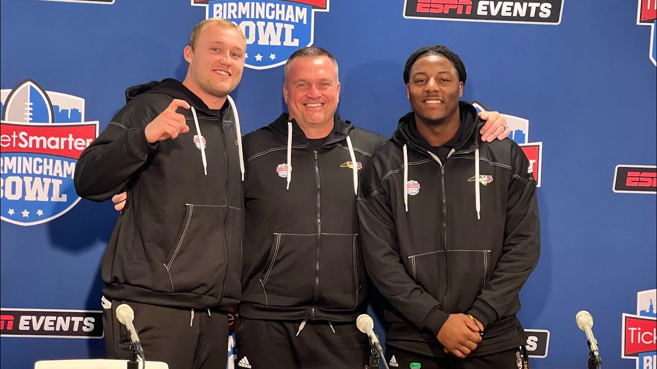 ECU Football Coach Mike Houston, QB Holton Ahlers & LB Myles Berry at the Birmingham Bowl