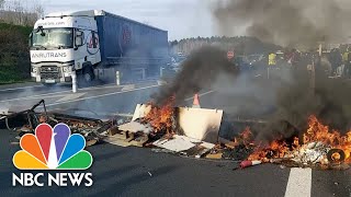 Protesters block French highway, garbage depot over pension reforms