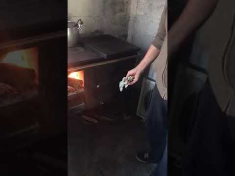 Video: Estufa con calentamiento de agua con chimenea. Reseñas del horno con circuito de calentamiento de agua