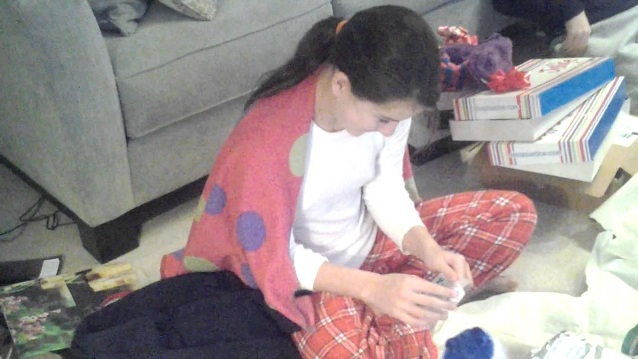 Teenage girl's reaction to getting One Direction concert tickets for Christmas