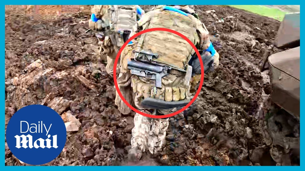 Ukrainian soldiers assault Russian trench in terrifying footage to capture last road to Bakhmut
