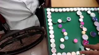 Agent  Orange Victim's family and playing with Rotosign used as educational toy.