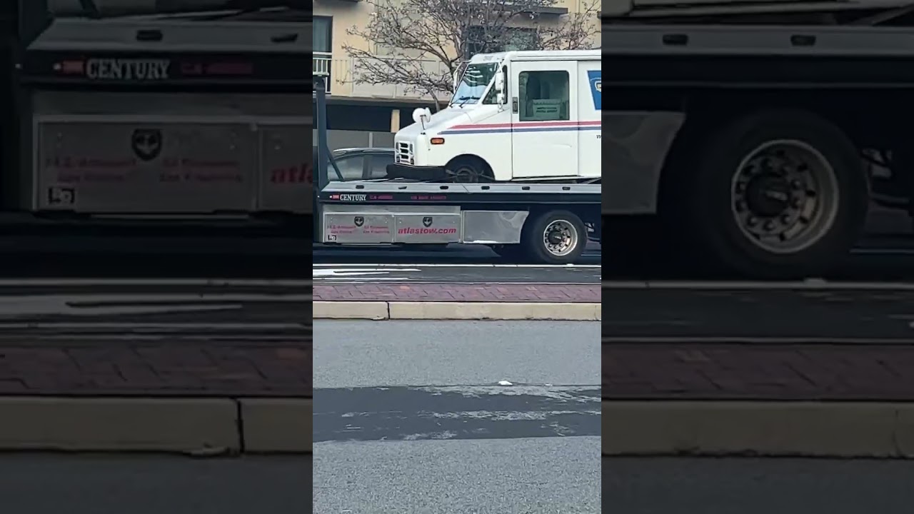 Unbelievable! USPS Truck Loaded on Top of Another Truck 