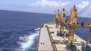 With a ship, passing Surigao Strait, The Philippines, in 2003