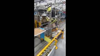 Operator working within a kitting AGV system