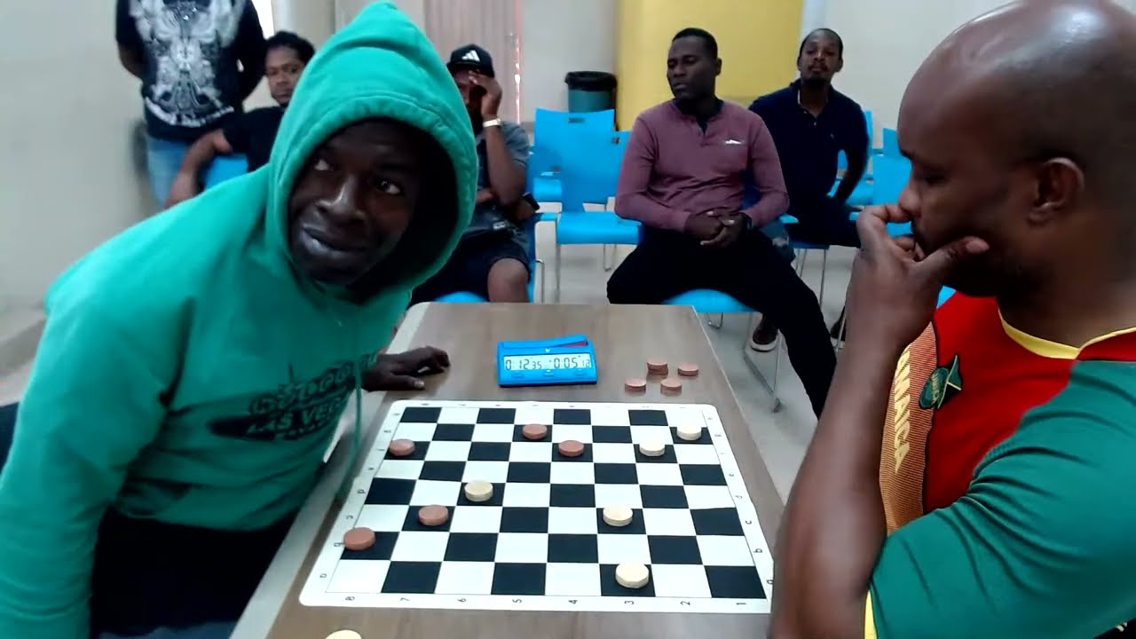 GMI Wayne 'Shines' Reid vs Jermaine 'Tiger' Delattibudiere (Game 12) Draughts in Jamaica