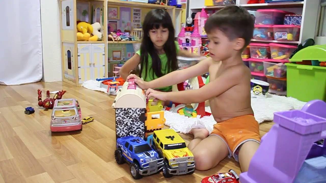 AmericanFilipino Girl and Boy Playing With Their Toys/Kidkraft