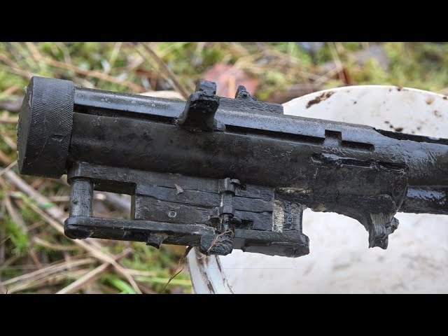 A submachine gun in the hands of a deceased soldier Excavations of