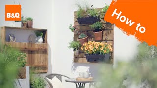 Add some life to your exterior walls by creating a homemade deck tile wall planter - perfect for small spaces and balconies. Visit the 