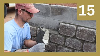 Putting Stones on an ugly Tornado Shelter to make it look nice. Vlog 15