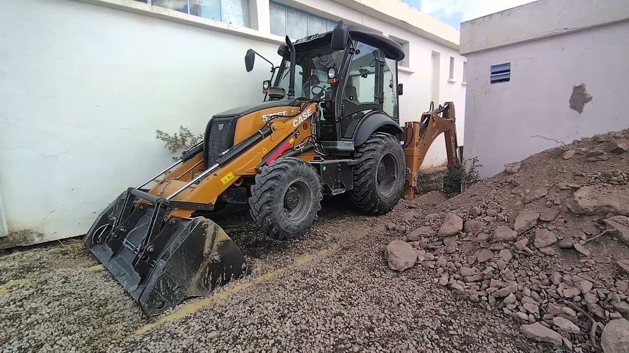 backhoe excavator jcb digging rock soil 