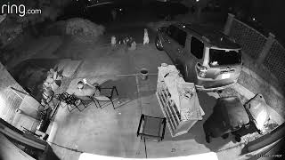 Family sits in front of their house then fireworks go off and they run away (Security camera)
