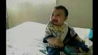 Laughing Baby Falls Over From Laughing