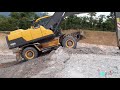 Tehnik memandu excavator VOLVO EW205D jenis ban karet naik slope..