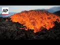 Lava flows from Mount Etna as Europe's largest active volcano erupts