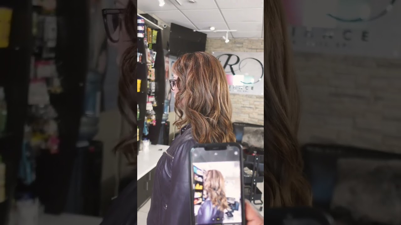 Beautiful brunette Highlights and Hair extensions in Calgary Salon 