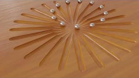 12 Balls rolling in straight lines appear to go in a circle.