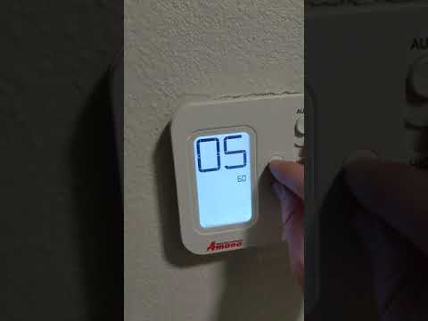 Another type of Holiday Inn Express Amana wall thermostat temperature limit override.