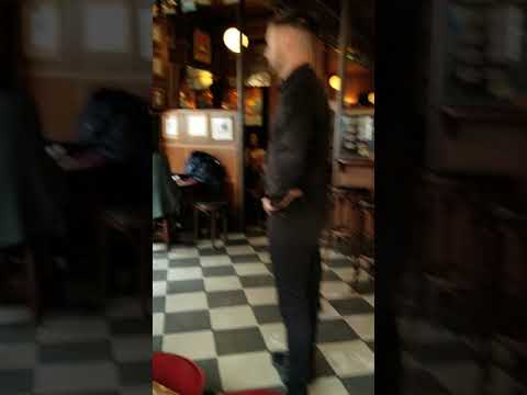 Bar Fight - Irish Pub Confrontation - Bartender Faces Off With Unruly Patron - Caught On Camera