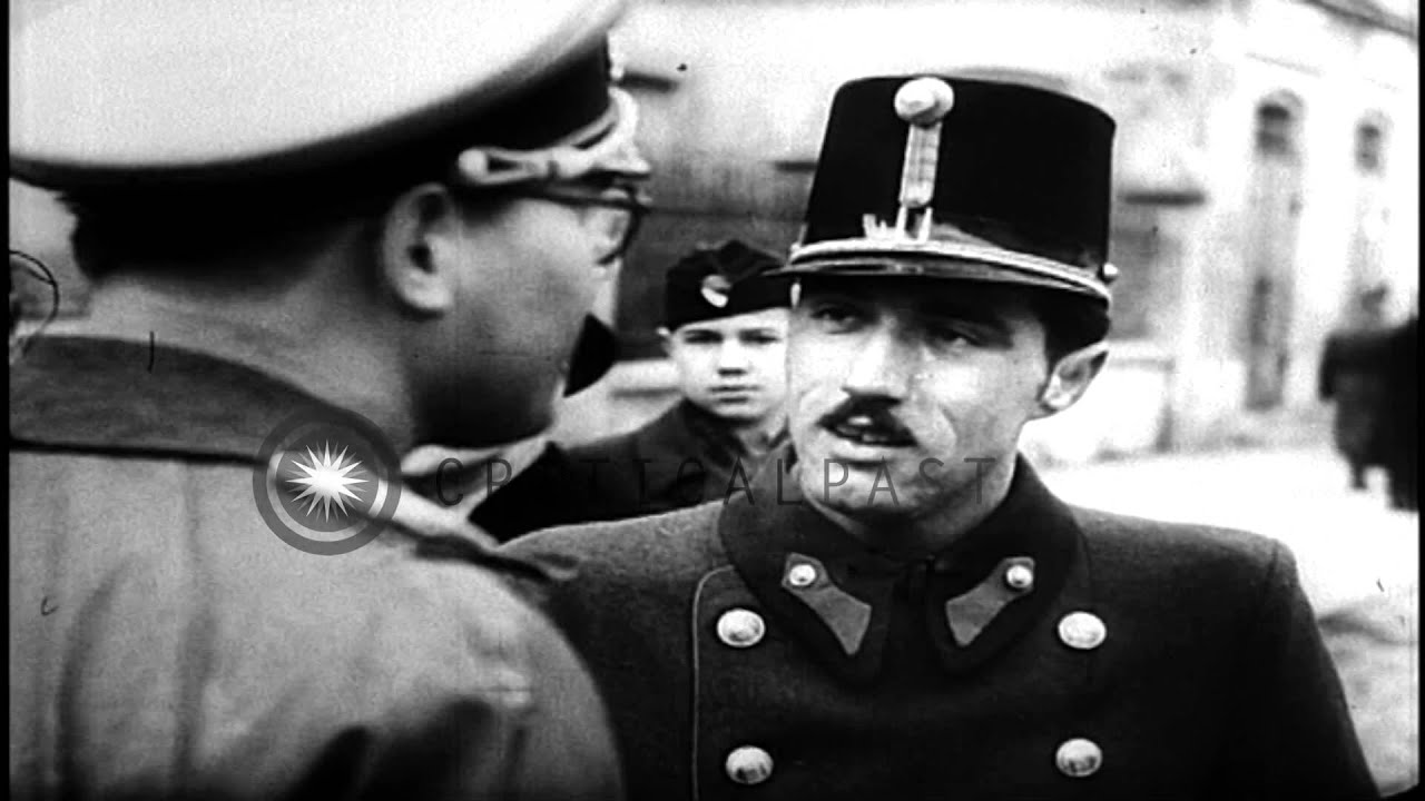 German troops enter Budapest city. Citizens greet them. Children play with German...HD Stock Footage