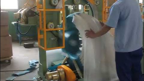 Coil wrapping machine for packing HDPE pipe by stretch wrapping