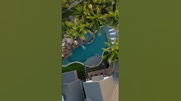 This backyard has an amazing slide, natural rock grotto, sunken fire pit, spa, putting green. #pool