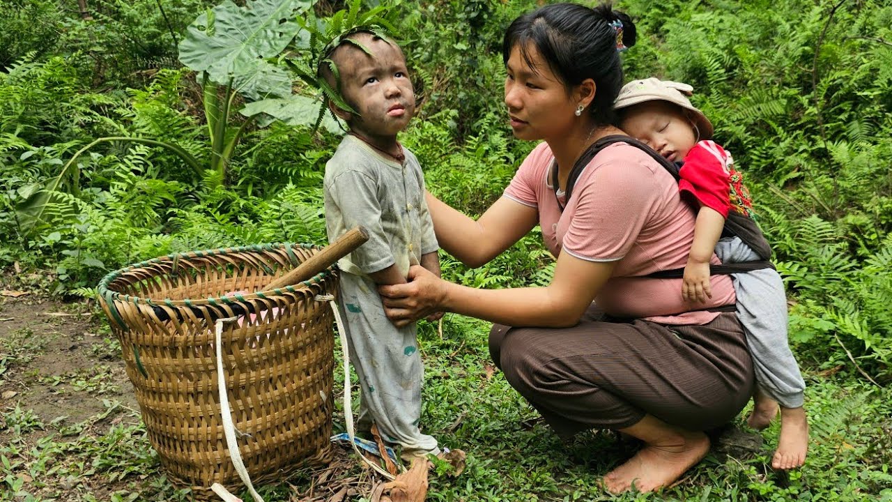 Mother and son go pick up snails in the forest on the way hom ...