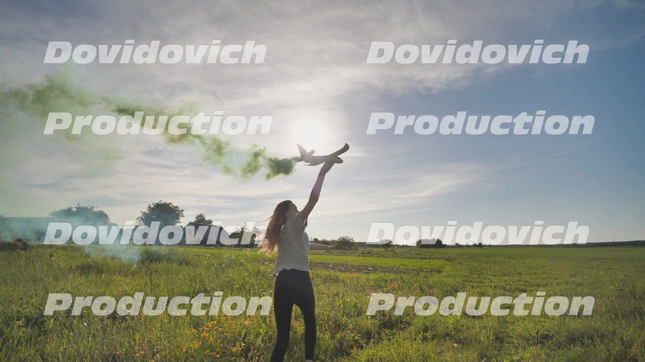 Beautiful girl runs with a toy airplane that emit colored smoke. The illusion of a working airplane.