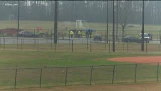 Burned body found next to sports field