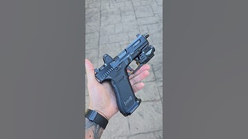 Gloss Black Glock 45 customized by Firing Squad Firearms. Stippling, Trijicon rmr, tlr-8ag, laser