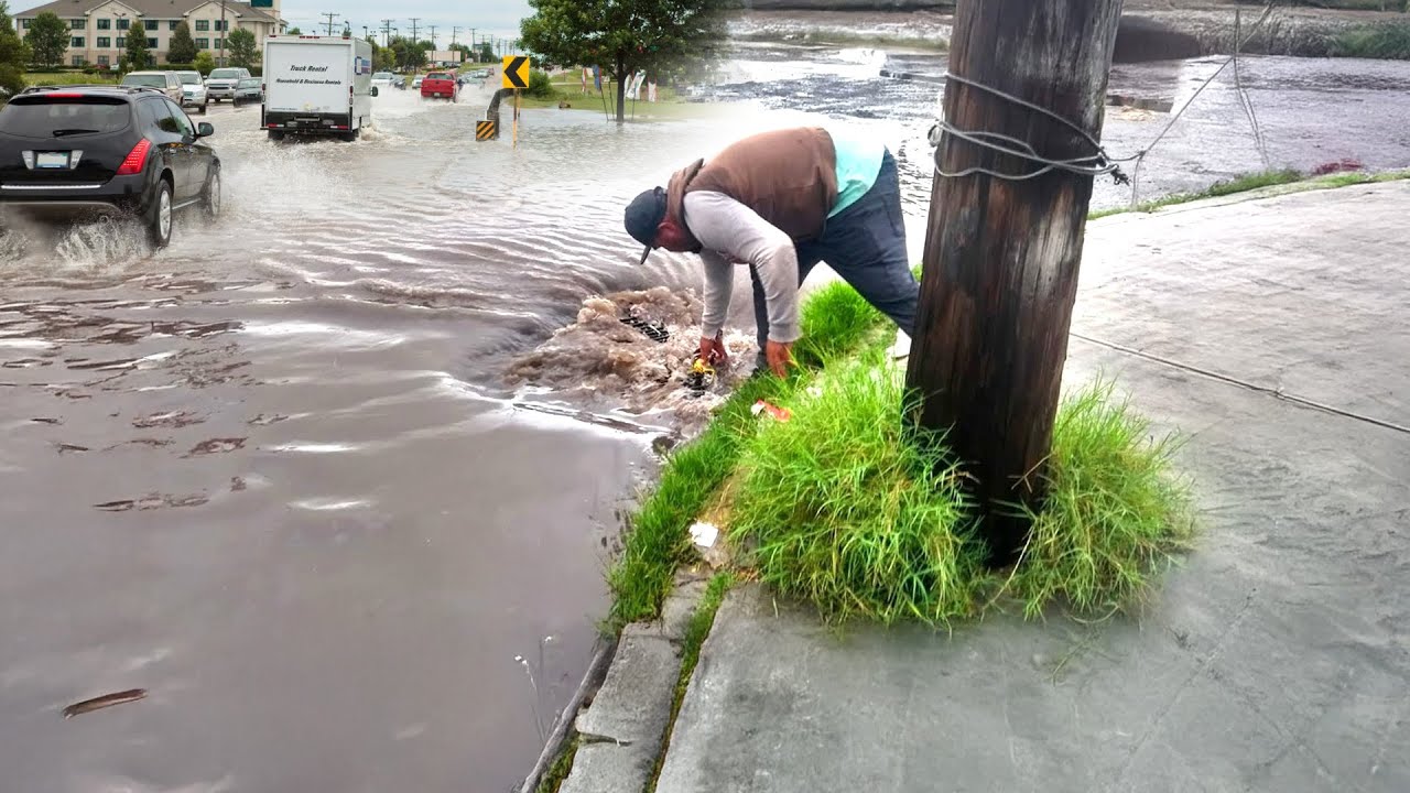 Unclogging Storm Drains Draining Solutions After Heavy Rainfall - YouTube