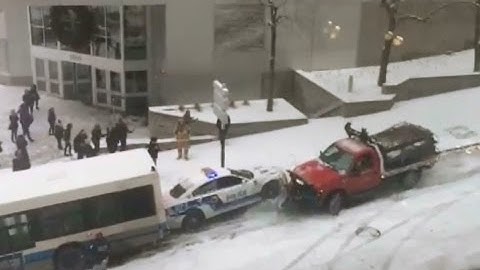 Cars & Buses Sliding Down and Crashing from a Snowy Slipery Slope - Montreal Canada