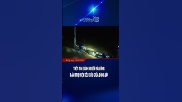 Thót tim cảnh người đàn ông bám trụ điện kêu cứu giữa dòng lũ