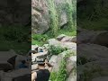 Adrenaline rush at huai kaeo waterfall muscle tattoos meet frothing waterlife unique travel 