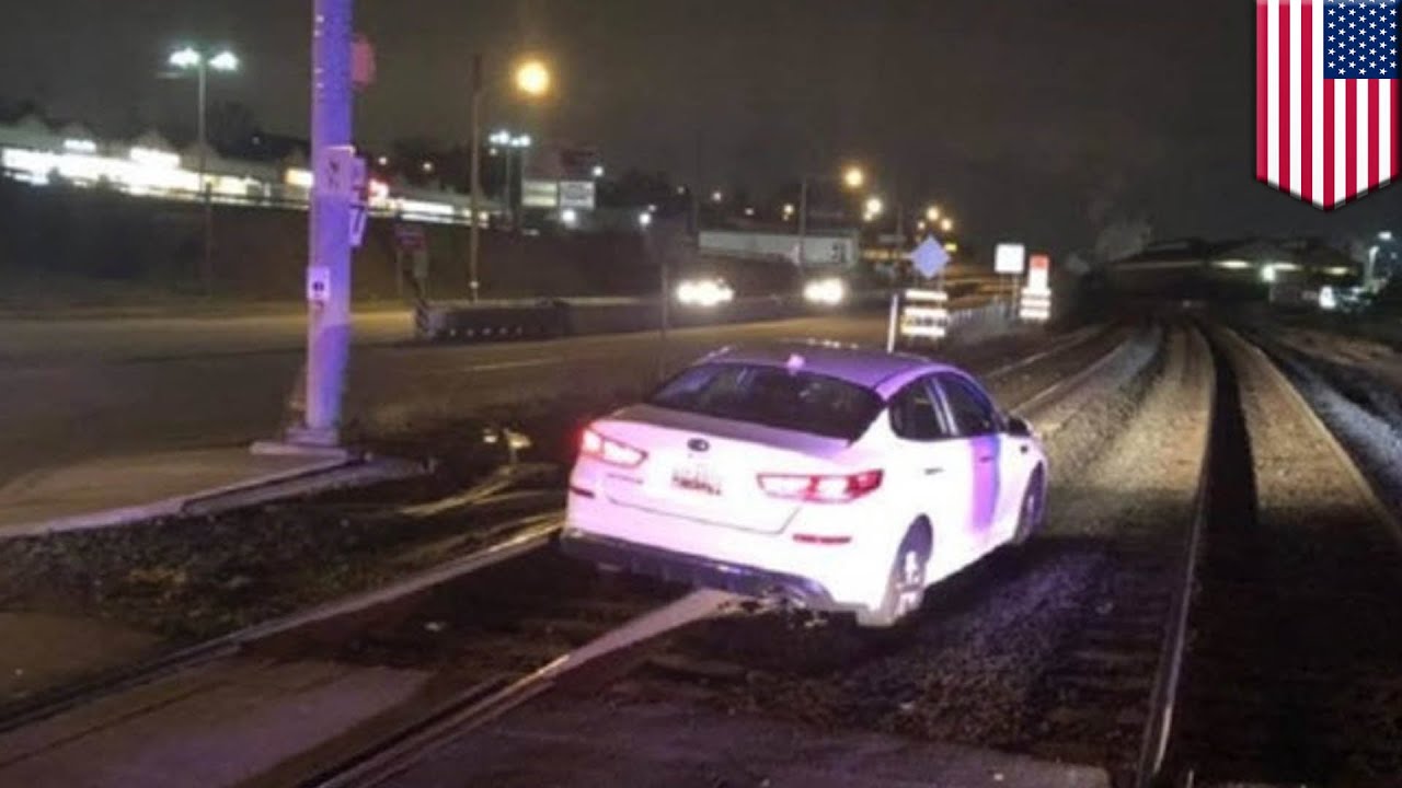 Woman drives onto train tracks because GPS said to - TomoNews