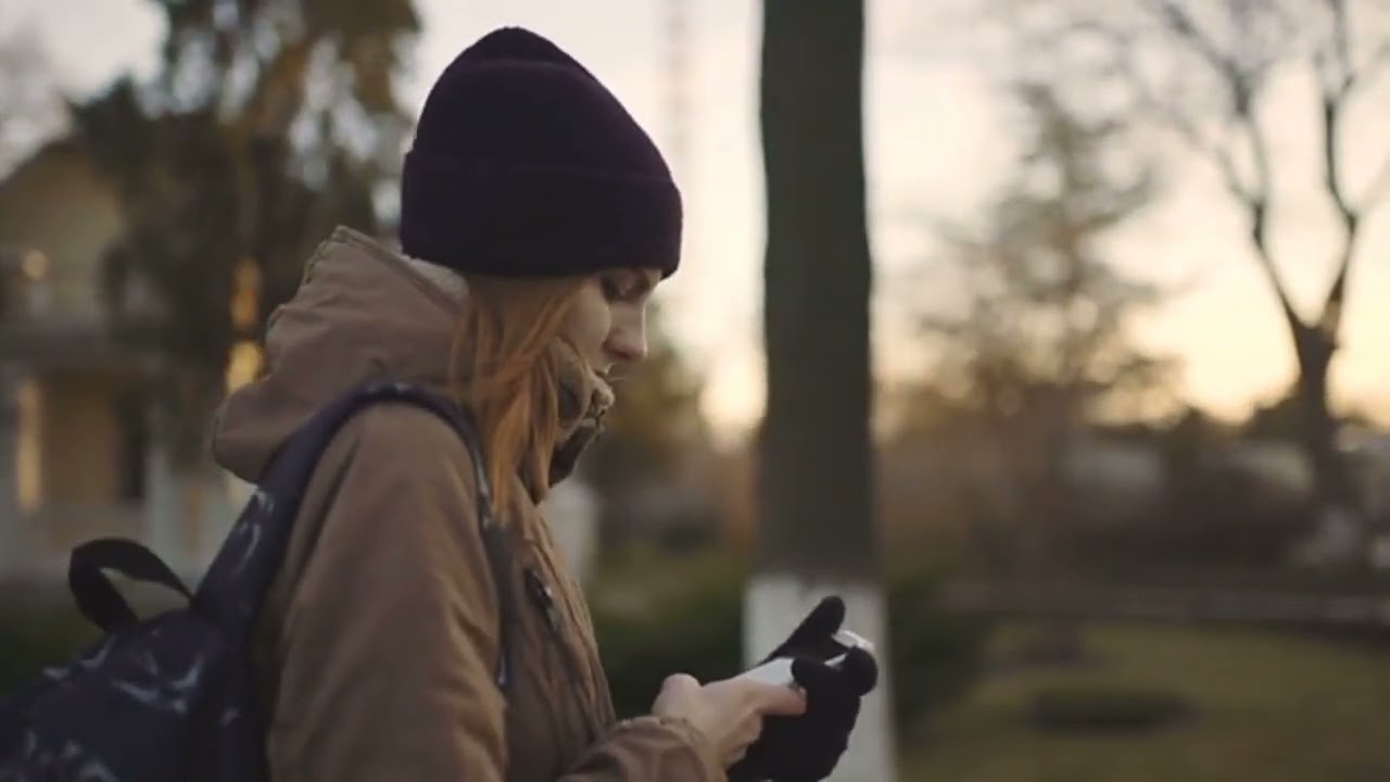 beautiful woman using smart phone technology app walking through city streets living