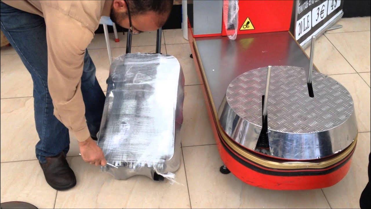 Упаковка багажа. Обмотчик багажа xl-01. Упаковать сумку в аэропорту. Упаковка сумки в аэропорту. Как упаковать багаж.