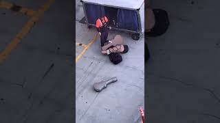 Baggage handler sparks outrage for tossing guitar on tarmac #shorts