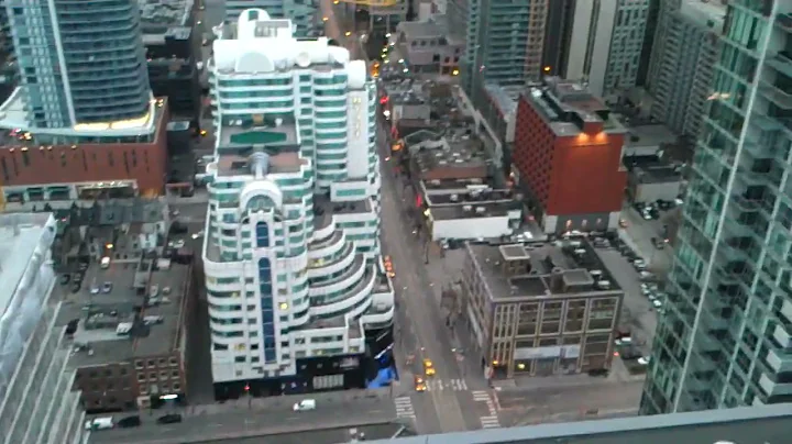 high rise window washing on a windy day