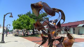 Sculpture, monument dedication commemorates dark chapter in Atchison